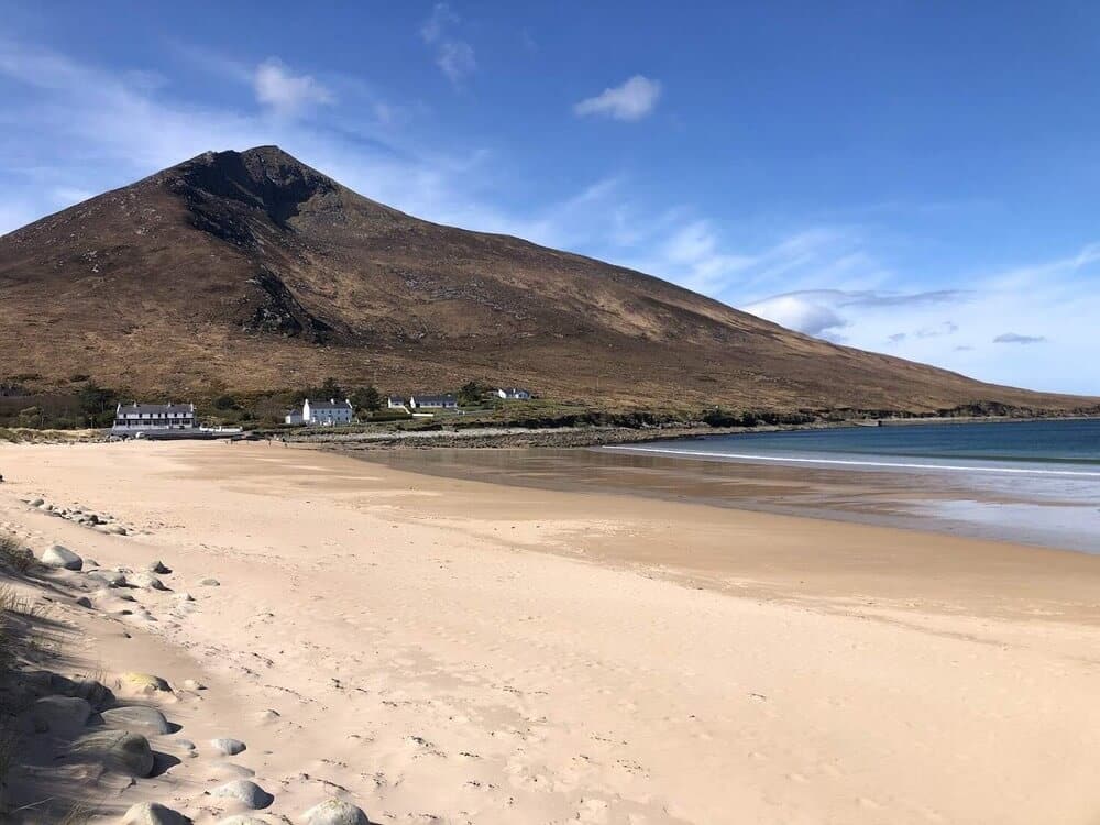 Sandy beach with mountain behind