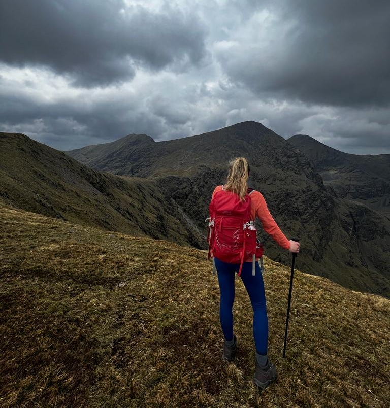 woman on mountain with backpack