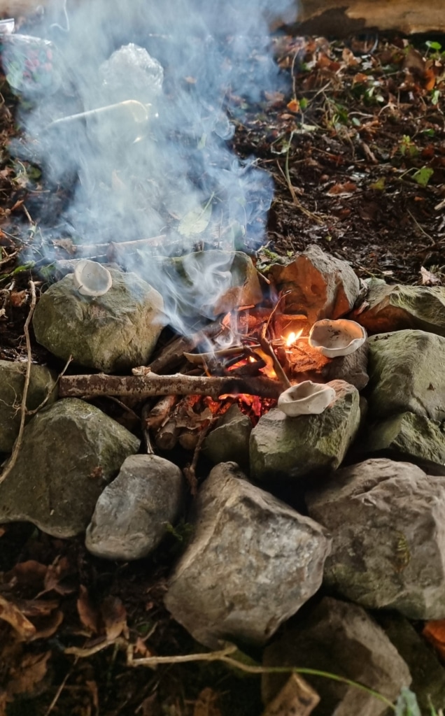 bonfire with children clay pots