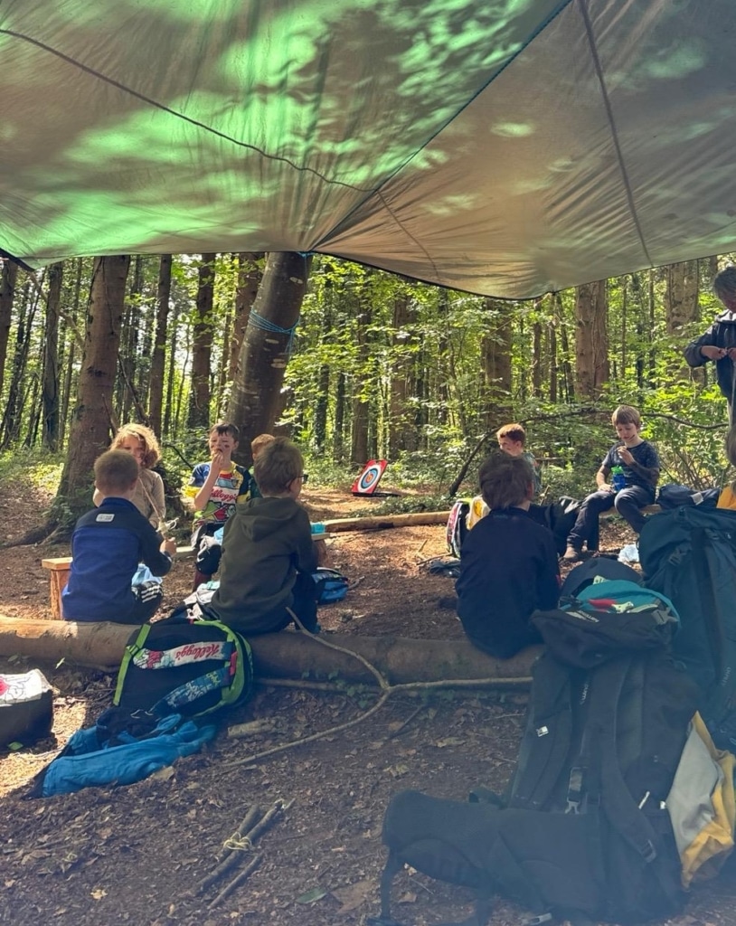 kids eating in forest campsite